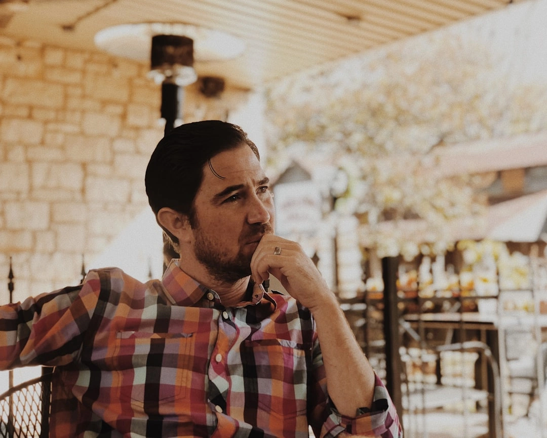 Business owner reviewing marketing analytics on laptop with coffee